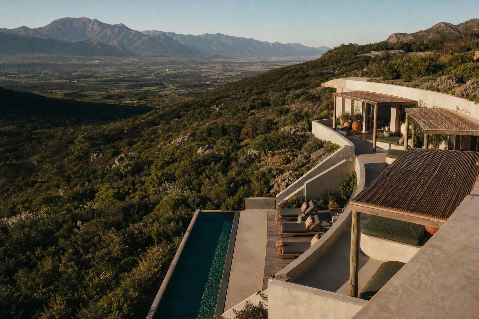 A contemporary lodge overlooking a dramatic South African mountain valley