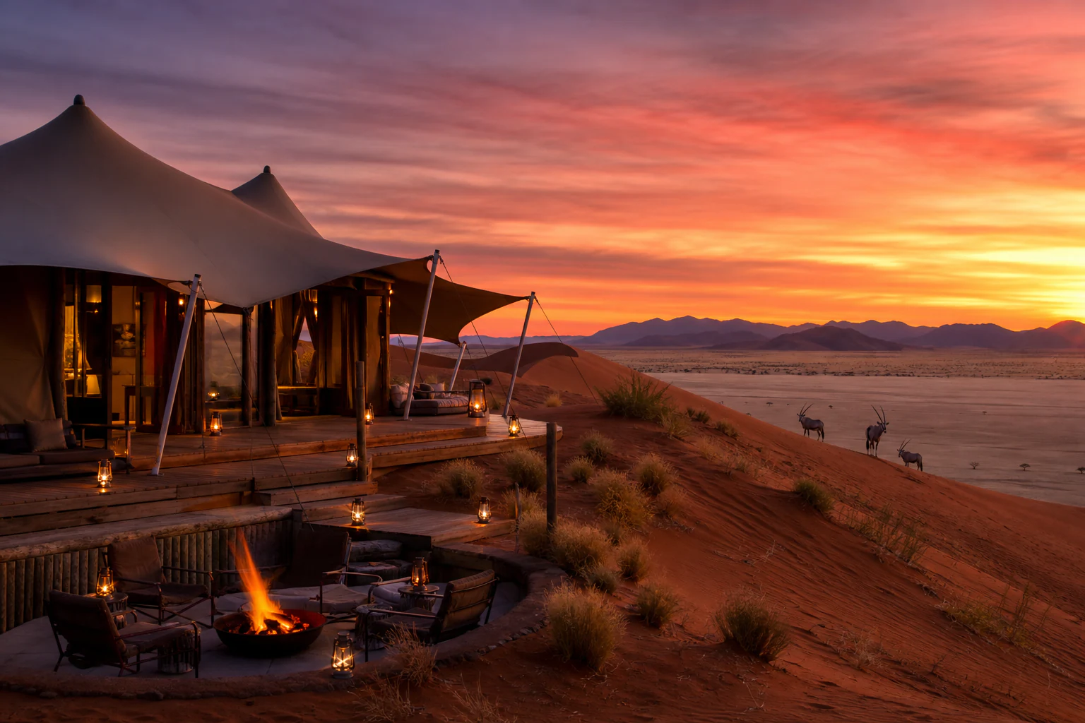 A luxury desert camp glowing at sunset